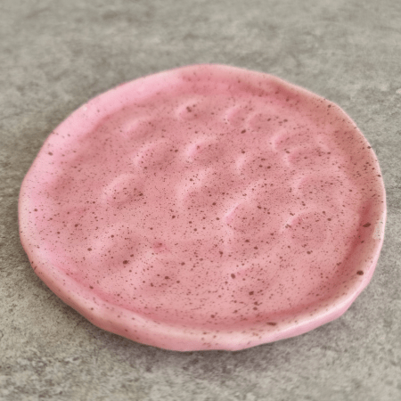 handmade pink plate with texture and dotted paint