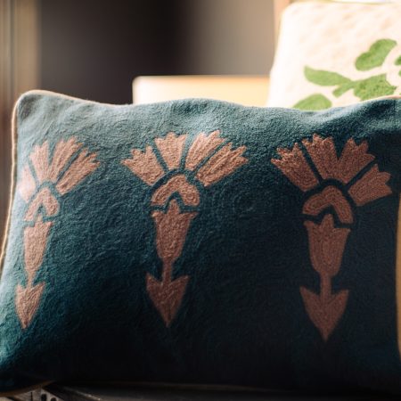Hand Embroidered Cushions in turquoise blue and pink with flower pattern.