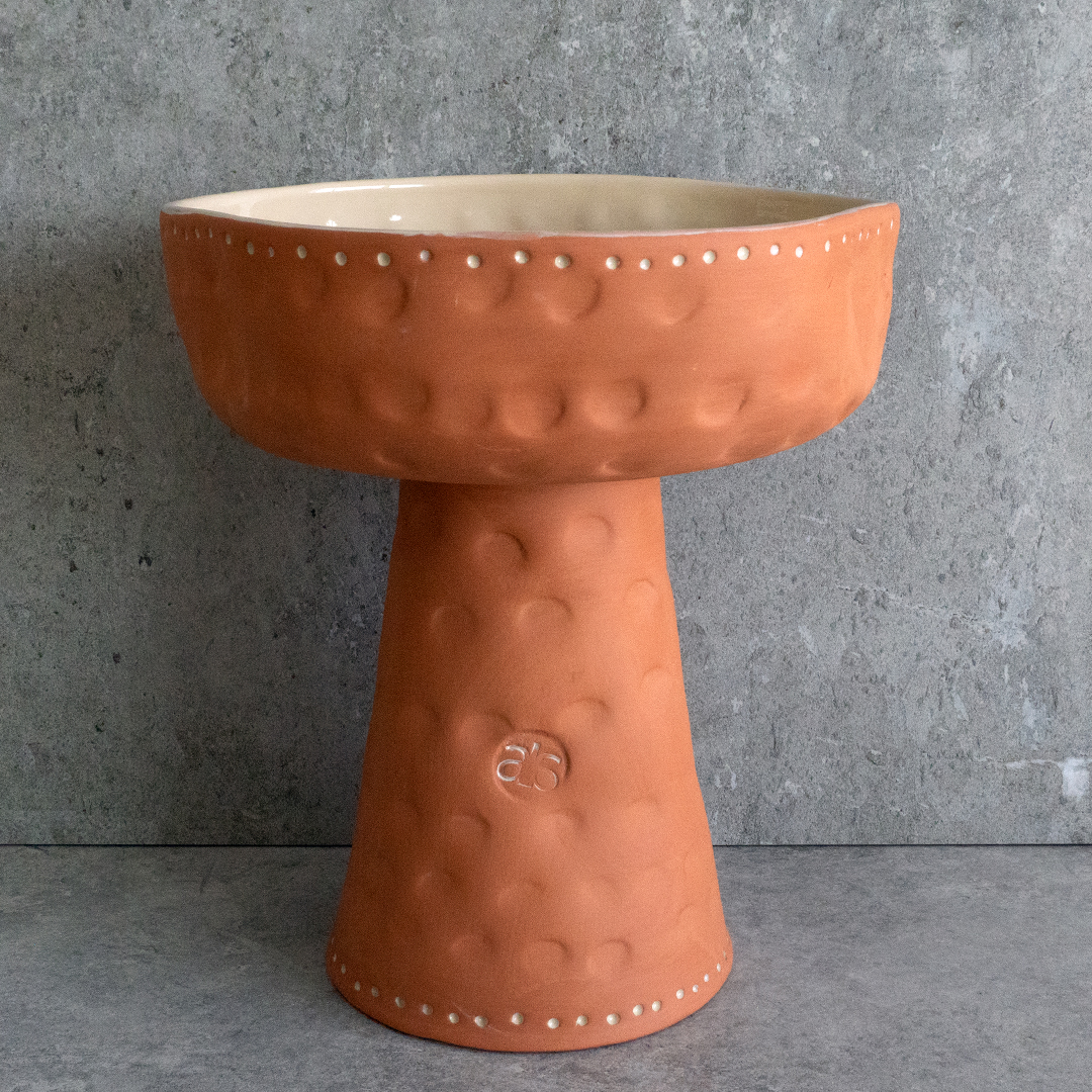Handcrafted ELEVATED TERRACOTTA BOWL with off-white glazing, suitable for use as a centerpiece, fruit bowl, or floral display.