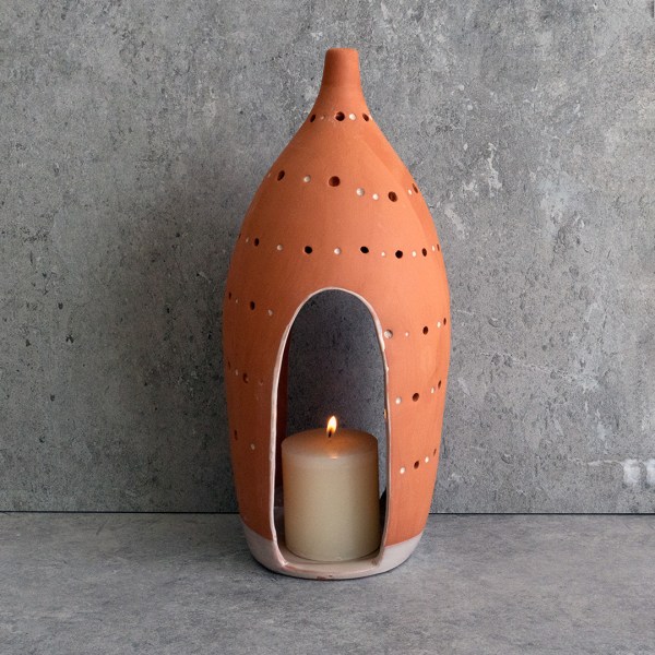 Handcrafted HANDCRAFTED CURVED LANTERNS made from terracotta with organic curves, ideal for creating a soft, peaceful glow indoors or outdoors.