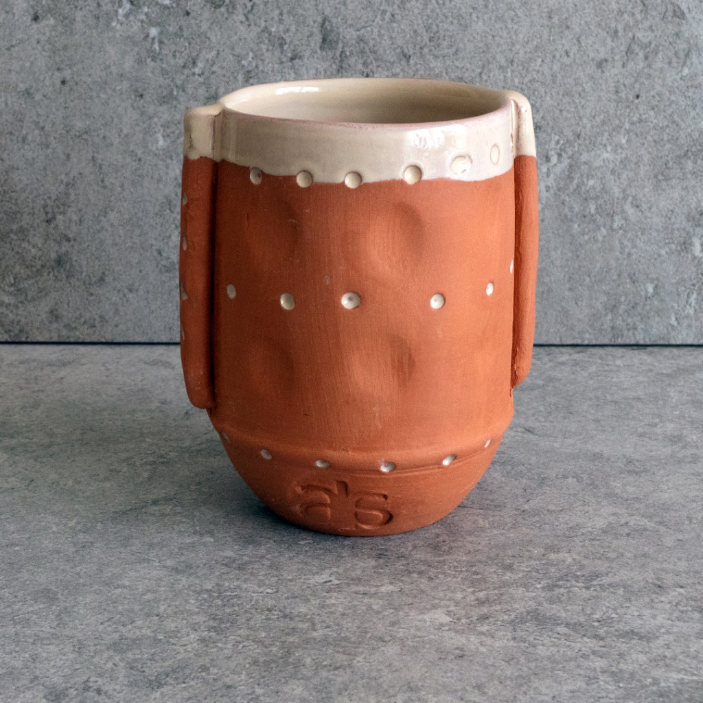 Hand-sculpted ORGANIC EAR CUP from terracotta, featuring ear-shaped handles and a subtle off-white glaze, perfect for tea, coffee, or display.